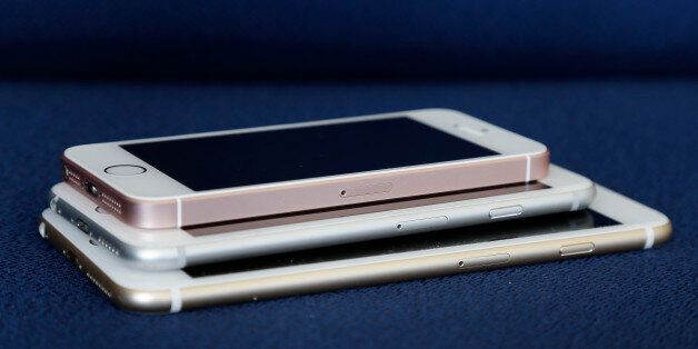 From bottom, the iPhone 6S Plus, 6S and SE lie stacked on one another in a comparison photograph, Thursday, March 24, 2016, in New York. Apple's new 4-inch iPhone SE is a good choice at a good price for many people. You get the same speeds, graphics capabilities and rear camera as the iPhone 6S, but for $250 less. (AP Photo/Julie Jacobson)