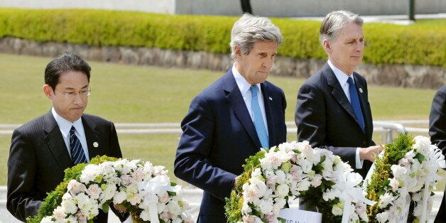 U.S. Secretary of State John Kerry (2nd L) prepares to lay a wreath at the cenotaph with Japan's Foreign Minister Fumio Kishida (L), Britain's Foreign Minister Philip Hammond and other fellow G7 foreign ministers at Hiroshima Peace Memorial Park and Museum in Hiroshima, Japan, in this photo released by Kyodo April 11, 2016. Mandatory credit REUTERS/Kyodo  ATTENTION EDITORS - FOR EDITORIAL USE ONLY. NOT FOR SALE FOR MARKETING OR ADVERTISING CAMPAIGNS. MANDATORY CREDIT. JAPAN OUT. NO COMMERCIAL OR