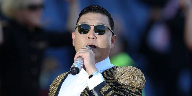 South Korean singer Psy performs before the Italian Cup final soccer match between AS Roma and SS Lazio at the Olympic Stadium in Rome May 26, 2013.  REUTERS/Alessandro Bianchi (ITALY - Tags: SPORT SOCCER ENTERTAINMENT)