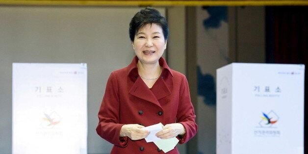 South Korean President Park Geun-hye casts her ballot at a polling station in Seoul, in this handout picture provided by the Presidential Blue House and released by News1 on April 13, 2016.  REUTERS/The Presidential Blue House/News1 ATTENTION EDITORS - THIS IMAGE HAS BEEN SUPPLIED BY A THIRD PARTY. FOR EDITORIAL USE ONLY. NOT FOR SALE FOR MARKETING OR ADVERTISING CAMPAIGNS. SOUTH KOREA OUT. NO COMMERCIAL OR EDITORIAL SALES IN SOUTH KOREA. FOR EDITORIAL USE ONLY. NO RESALES. NO ARCHIVES. THIS IMA
