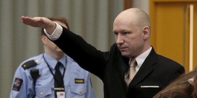 Mass killer Anders Behring Breivik raises his arm in a Nazi salute as he enters the court room in Skien prison, Norway March 15, 2016.  REUTERS/Lise Aserud/NTB Scanpix ATTENTION EDITORS - THIS IMAGE WAS PROVIDED BY A THIRD PARTY. FOR EDITORIAL USE ONLY. NOT FOR SALE FOR MARKETING OR ADVERTISING CAMPAIGNS. THIS PICTURE IS DISTRIBUTED EXACTLY AS RECEIVED BY REUTERS, AS A SERVICE TO CLIENTS. NORWAY OUT. NO COMMERCIAL OR EDITORIAL SALES IN NORWAY. NO COMMERCIAL SALES.      TPX IMAGES OF THE DAY