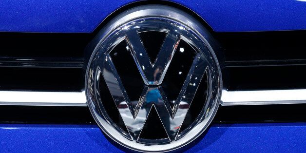 A Volkswagen (VW) logo is pictured on a car on the company's booth during the second media day of the 86th International Motor Show in Geneva, Switzerland, March 2, 2016.  REUTERS/Denis Balibouse