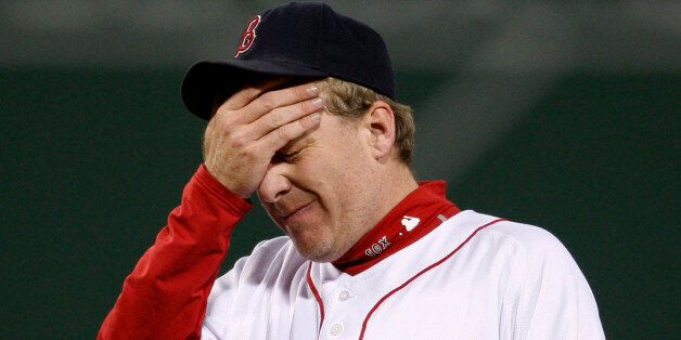 Boston Red Sox pitcher Curt Schilling reacts after giving up a home run to Cleveland Indians' Grady Sizemore during the fifth inning in Game 2 of Major League Baseball's ALCS playoff series in Boston, October 13, 2007. REUTERS/Brian Snyder  (UNITED STATES)