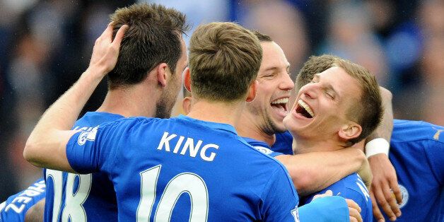 Leicester's Marc Albrighton, center right, celebrates with team mates after scoring against Swansea during the English Premier League soccer match between Leicester City and Swansea City at the King Power Stadium in Leicester, England, Sunday, April 24, 2016. (AP Photo/Rui Vieira)