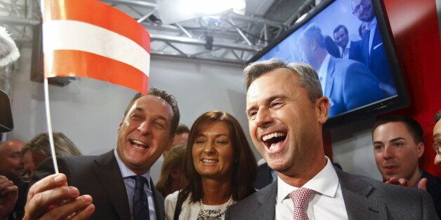 Presidential candidate Norbert Hofer (R) and head of the Austrian Freedom party Heinz-Christian Strache (L) react at the party headquarter in Vienna, Austria, April 24, 2016. REUTERS/Heinz-Peter Bader