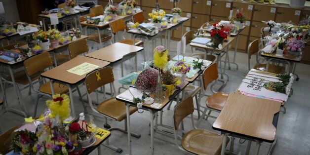 Desks used by victims who were onboard sunken ferry Sewol are seen at an empty classroom, which was preserved since the disaster, at Danwon high school during the second anniversary of the disaster in Ansan, South Korea, April 16, 2016.  REUTERS/Kim Hong-Ji