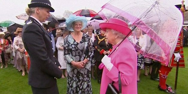 Britain's Queen Elizabeth speaks to Commander Lucy D'Orsi during a garden party at Buckingham Palace in London, in this still image taken from video, Britain, May 10, 2016.  REUTERS/ROYAL POOL via Reuters TV.  ATTENTION EDITORS -  UNITED KINGDOM OUT. NO COMMERCIAL OR EDITORIAL SALES IN UNITED KINGDOM.  TPX IMAGES OF THE DAY
