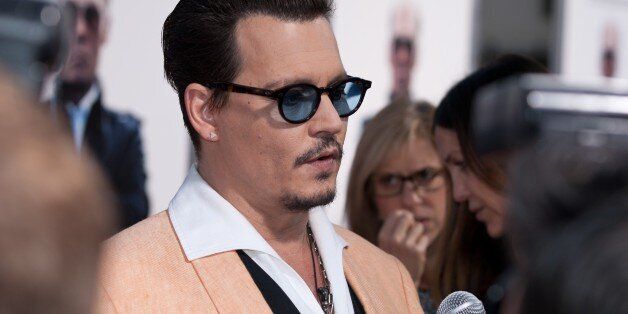 BROOKLINE, MA - SEPTEMBER 15:  Actor Johnny Depp arrives on the red carpet for the Boston premiere of 'Black Mass' at Coolidge Theater on September 15, 2015 in Brookline, Massachusetts.  (Photo by Eric Frazer/FilmMagic)
