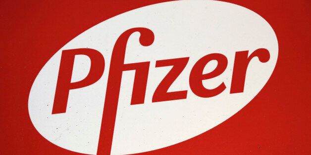 The Pfizer logo is displayed at world headquarters, Monday, Nov. 23, 2015 in New York. Pfizer and Allergan will join in a $160 billion deal to create the world's largest drugmaker. (AP Photo/Mark Lennihan)