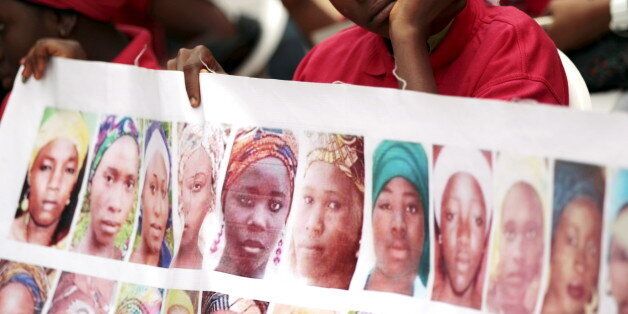 Bring Back Our Girls (BBOG) campaigners look on during a protest procession marking the 500th day since the abduction of girls in Chibok, along a road in Abuja August 27, 2015. The Islamist militant group Boko Haram kidnapped some 270 girls and women from a school in Chibok a year ago. More than 50 eventually escaped, but at least 200 remain in captivity, along with scores of other girls kidnapped before the Chibok girls. REUTERS/Afolabi Sotunde