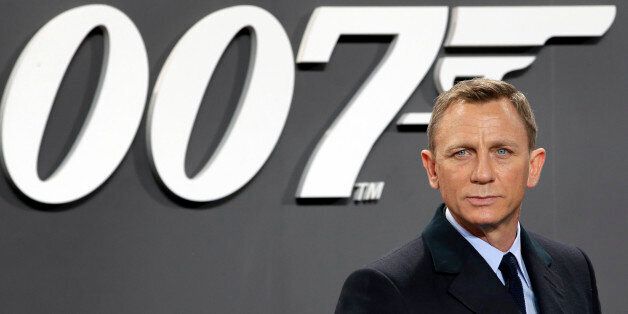 Actor Daniel Craig poses for the media as he arrives for the German premiere of the James Bond movie 'Spectre' in Berlin, Germany, Wednesday, Oct. 28, 2015. (AP Photo/Michael Sohn)