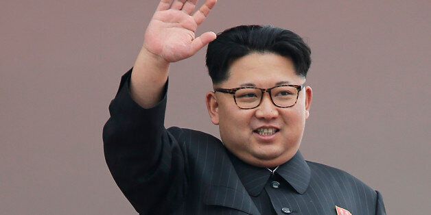 North Korean leader Kim Jong Un waves at parade participants at the Kim Il Sung Square on Tuesday, May 10, 2016, in Pyongyang, North Korea. Hundreds of thousands of North Koreans celebrated the country's newly completed ruling-party congress with a massive civilian parade featuring floats bearing patriotic slogans and marchers with flags and pompoms. (AP Photo/Wong Maye-E)