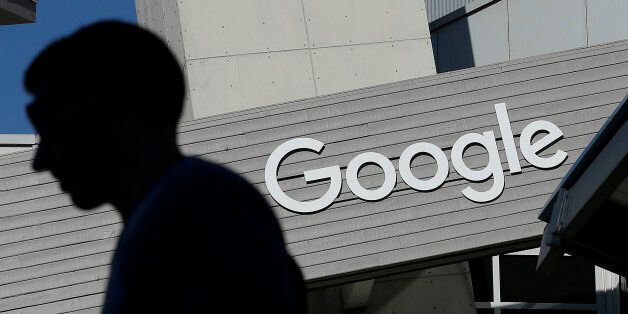 FILE - In this Nov. 12, 2015, file photo, a man walks past a building on the Google campus in Mountain View, Calif. Google said Wednesday, May 11, 2016, that it will ban ads from payday lenders, calling the industry âdeceptiveâ and âharmful.â Google said it will no longer allow ads for loans due within 60 days and will also ban ads for loans where the interest rate is 36 percent or higher. The ban is effective July 13. (AP Photo/Jeff Chiu, File)