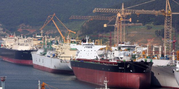 Okpo shipyard of South Korea's Daewoo Shipbuilding & Marine Engineering (DSME) is seen in Koeje island.  Okpo shipyard of South Korea's Daewoo Shipbuilding & Marine Engineering (DSME) is seen in Koeje island of South Kyongsang province, about 470 km (292 miles) southeast of Seoul, May 17, 2005. The DSME is the world's second largest shipyard. REUTERS/Lee Jae-Won