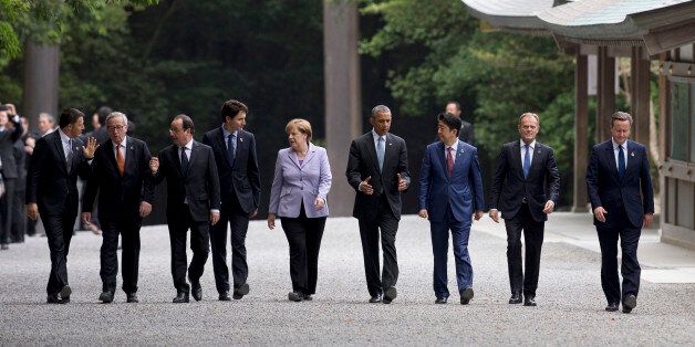From left, Italian Premier Matteo Renzi, European Commission President Jean-Claude Juncker, French President Francois Hollande, Canadian Prime Minister Justin Trudeau, German Chancellor Angela Merkel, U.S. President Barack Obama, Japanese Prime Minister Shinzo Abe, European Council President Donald Tusk, and British Prime Minister David Cameron, walk past the Kaguraden as they visit Ise Jingu shrine in Ise, Mie Prefecture, Japan, Thursday, May 26, 2016, as part of the G-7 Summit. (AP Photo/Carol