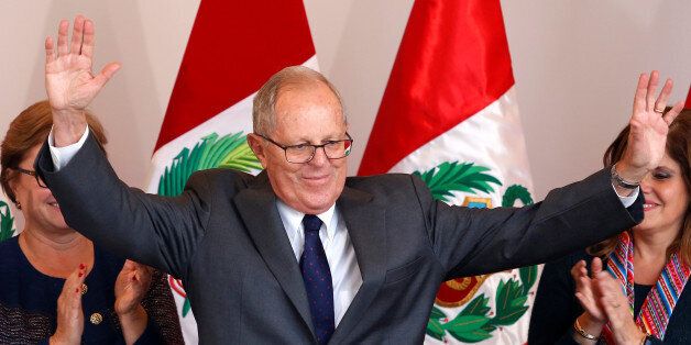 Peruvian presidential candidate Pedro Pablo Kuczynski, greets the press after Peru's electoral office ONPE said that he won more votes than Keiko Fujimori in the country's cliffhanger presidential election in his headquarters in Lima, Peru, June 9, 2016.  REUTERS/Janine Costa