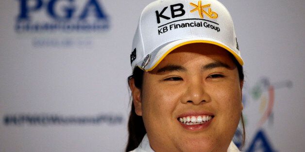 Inbee Park, of South Korea, begins to address a news conference after finishing the first round at the Women's PGA Championship golf tournament at Sahalee Country Club Thursday, June 9, 2016, in Sammamish, Wash. With the completed round, Park becomes eligible for the LPGA Hall of Fame. (AP Photo/Elaine Thompson)