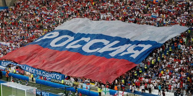 Football Soccer - England v Russia - EURO 2016 - Group B - Stade Velodrome, Marseille, France - 11/6/16 - Russian team supporters stretch giant Russian flag in the stands.   REUTERS/Robert Pratta