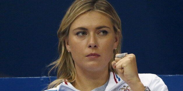 Russia's Maria Sharapova reacts as she watches compatriot Ekaterina Makarova play against Kiki Bertens of the Netherlands during their Fed Cup World Group tennis match in Moscow, February 6, 2016.  REUTERS/Grigory Dukor