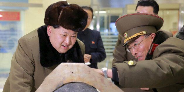 FILE PHOTO: North Korean leader Kim Jong Un looks at a rocket warhead tip after a simulated test of atmospheric re-entry of a ballistic missile, at an unidentified location in this undated photo released by North Korea's Korean Central News Agency (KCNA) in Pyongyang on March 15, 2016.    KCNA/File Photo via REUTERS  ATTENTION EDITORS - THIS IMAGE WAS PROVIDED BY A THIRD PARTY. EDITORIAL USE ONLY. REUTERS IS UNABLE TO INDEPENDENTLY VERIFY THIS IMAGE. NO THIRD PARTY SALES. SOUTH KOREA OUT. NO COM