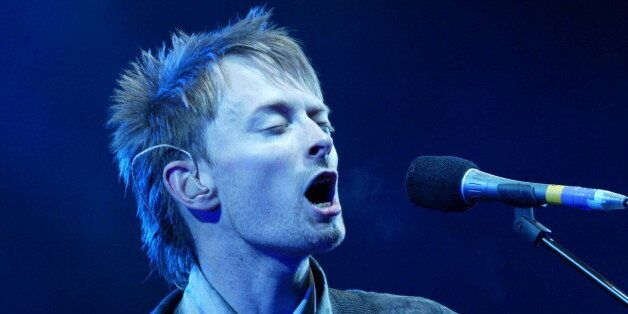 Thom Yorke, lead singer of 'Radiohead' performs at the Glastonbury Festival, Somerset, June 28, 2003. [The annual music and arts festival attracts over one hundred thousand festival goers, with musical highlights being REM  and Radiohead playing.]