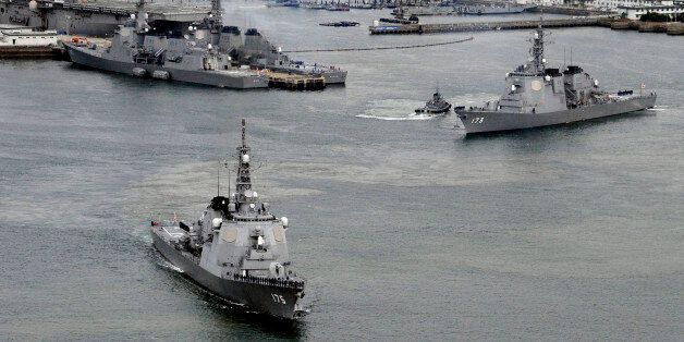 Japan Maritime Self-Defense Force's (JMSDF) Aegis destroyers Myoko (L) and Kongo sail off from the JMSDF Sasebo base in Sasebo, southern Japan, in this photo taken by Kyodo December 6, 2012. Japan's Defence Ministry plans to deploy three Aegis destroyers armed with SM-3 missile interceptors in the East China Sea and the Sea of Japan in response to North Korea's plan to launch the rocket between December 10 and 22, Kyodo news reports. They left Sasebo in Nagasaki prefecture on Thursday morning. M
