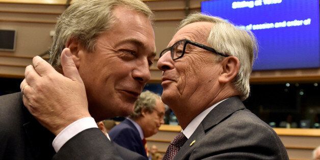 European Commission President Jean-Claude Juncker welcomes Nigel Farage, the leader of the United Kingdom Independence Party, prior to a plenary session at the European Parliament on the outcome of the