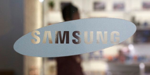 In this Oct. 29, 2015 photo, a logo of Samsung Electronics Co. is seen at its shop in Seoul, South Korea. Samsung Electronics said Friday,  Jan. 8, 2016, that its fourth-quarter profit rose 15 percent over a year earlier, a smaller-than-expected gain as the world's largest maker of smartphones and memory chips struggles to revive growth. (AP Photo/Lee Jin-man)