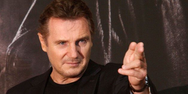 Actor Liam Neeson poses before a news conference to promote his movie,