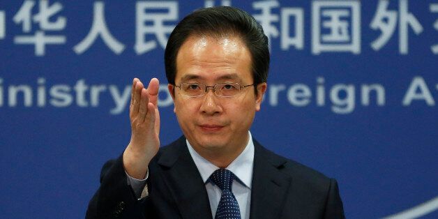 China's Foreign Ministry spokesman Hong Lei gestures during a daily briefing at the Ministry of Foreign Affairs office in Beijing, Tuesday, April 5, 2016. The ministry on Tuesday denounced as âgroundlessâ reports based on documents leaked from a Panama-based law firm that name relatives of current and retired Chinese politicians, including President Xi Jinping, as owning offshore companies. Hong said he would not further discuss the reports and declined to say whether the individuals n