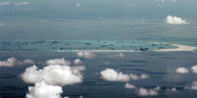 FILE - This May 11, 2015, file photo, shows land reclamation of Mischief Reef in the Spratly Islands in the South China Sea. An international tribunal has found that there is no legal basis for China's claiming rights to much of the South China Sea. The Permanent Court of Arbitration (PCA) issued its ruling Tuesday, July 12, 2016, in The Hague in response to an arbitration case brought by the Philippines against China regarding the South China Sea, saying that any historic rights to resources th