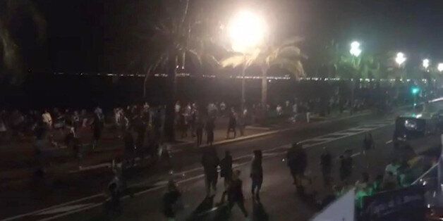 In this UGC video grab provided by Harp Detective on Thursday July 14, 2016, people run out from the scene after a truck drove on to the sidewalk and plowed through a crowd of revelers whoâd gathered to watch the fireworks in the French resort city of Nice. Officials and eyewitnesses described as a deliberate attack. There appeared to be many casualties. (Harp Detective via AP)
