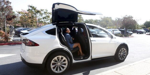 A Tesla Model X picks up passengers during a Tesla event in Palo Alto, California October 14, 2015. REUTERS/Beck Diefenbach