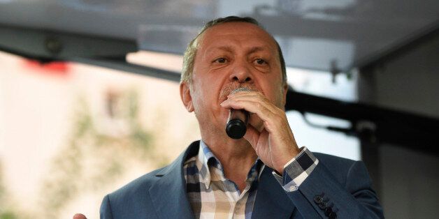 Turkish President Recep Tayyip Erdogan delivers a speech in Istanbul, Saturday, July 16, 2016. Forces loyal to Erdogan quashed a coup attempt in a night of explosions, air battles and gunfire that left some hundreds of people dead and scores of others wounded Saturday. The chaos Friday night and Saturday came amid a period of political turmoil in Turkey _ a NATO member and key Western ally in the fight against the Islamic State group _ that critics blame on Erdogan's increasingly authoritarian r