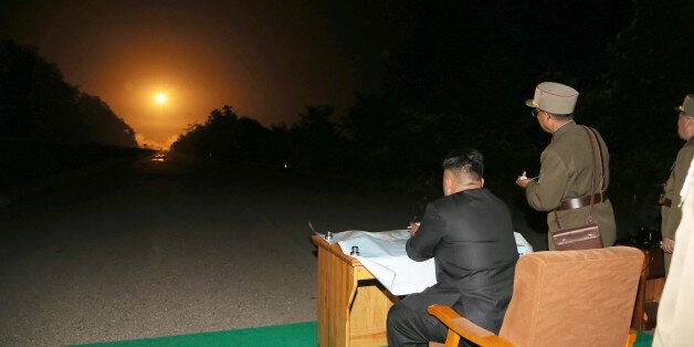 North Korean leader Kim Jong Un provides field guidance during a tactical rocket firing drill carried out by units of the Korean People's Army (KPA) Strategic Force in the western sector of the front in this undated photo released by North Korea's Korean Central News Agency (KCNA) in Pyongyang on July 10, 2014. REUTERS/KCNA (NORTH KOREA - Tags: POLITICS MILITARY) ATTENTION EDITORS ? THIS PICTURE WAS PROVIDED BY A THIRD PARTY. REUTERS IS UNABLE TO INDEPENDENTLY VERIFY THE AUTHENTICITY, CONTENT, L