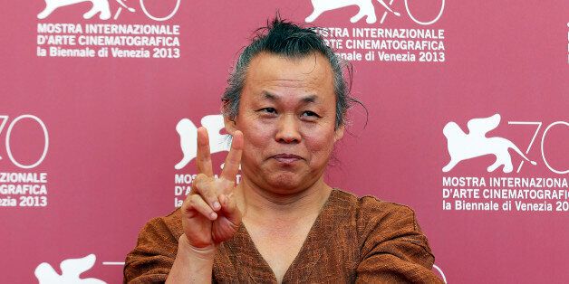 Director Kim Ki-duk poses during a photocall for his movie
