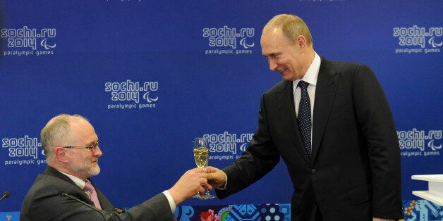 Russia's President Vladimir Putin (R) toasts with President of the International Paralympic Committee Philip Craven before the opening ceremony of the 2014 Paralympic Winter Games in Sochi, March 7, 2014. REUTERS/Mikhail Klimentyev/RIA Novosti/Kremlin (RUSSIA  - Tags: POLITICS OLYMPICS SPORT) ATTENTION EDITORS - THIS IMAGE HAS BEEN SUPPLIED BY A THIRD PARTY. IT IS DISTRIBUTED, EXACTLY AS RECEIVED BY REUTERS, AS A SERVICE TO CLIENTS