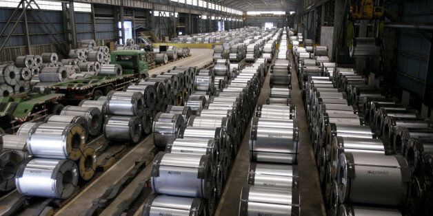 Columns of steel are stacked inside the China Steel production factory in Kaohsiung May 18, 2010.   REUTERS/Pichi Chuang/File Photo
