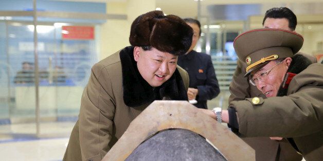 FILE PHOTO: North Korean leader Kim Jong Un looks at a rocket warhead tip after a simulated test of atmospheric re-entry of a ballistic missile, at an unidentified location in this undated photo released by North Korea's Korean Central News Agency (KCNA) in Pyongyang on March 15, 2016.     REUTERS/KCNA ATTENTION EDITORS - THIS PICTURE WAS PROVIDED BY A THIRD PARTY. REUTERS IS UNABLE TO INDEPENDENTLY VERIFY THE AUTHENTICITY, CONTENT, LOCATION OR DATE OF THIS IMAGE. FOR EDITORIAL USE ONLY. NOT FOR