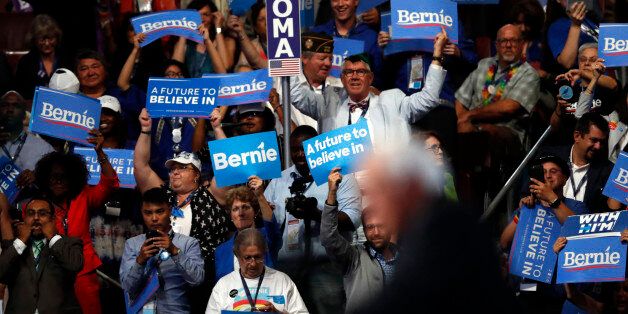 Supporters cheer as former Democratic Presidential candidate, Sen. Bernie Sanders, I-Vt., speaks during the first day of the Democratic National Convention in Philadelphia, Monday, July 25, 2016. (AP Photo/Paul Sancya)