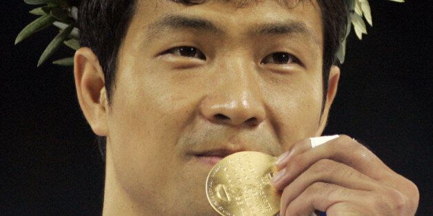 Dae Sung Moon, from Korea, displays his gold medal after defeating Alexandros Nilolaidis, from Greece, with a technical knockout in men's over 80kg taekwondo at the 2004 Olympic Games in Athens, Greece, Sunday, Aug. 29, 2004. (AP Photo/Al Behrman)