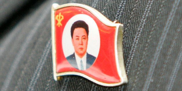 A North Korean labour union leader wears an insignia representing North Korean leader Kim Jong-il during an inter-Korean Labour Day celebration in Changwon, about 400 km (249 miles) southeast of Seoul, April 30, 2007. Sixty labourers and officials from the North arrived in the South on Sunday to participate in a joint Labour Day celebration with South Korea's Korean Confederation of Trade Unions and the Federation of Korean Trade Unions. The celebration, which is the first of such inter-Korean L