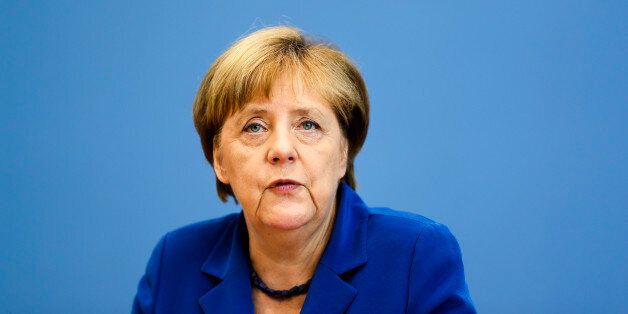 German Chancellor Angela Merkel attends a news conference in Berlin Thursday, July 28, 2016. Chancellor Angela Merkel says the fact that two men who came to Germany as refugees carried out attacks claimed by the Islamic State group
