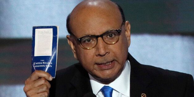 Khizr Khan, whose son, Humayun S. M. Khan was one of 14 American Muslims who died serving in the U.S. Army  in the 10 years after the 9/11 attacks, offers to loan his copy of the Constitution to Republican U.S. presidential nominee Donald Trump, as he speaks during the last night of the Democratic National Convention in Philadelphia, Pennsylvania, U.S. July 28, 2016. REUTERS/Mike Segar