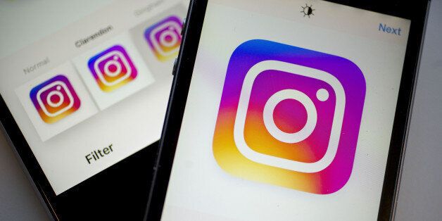 Facebook Inc.'s Instagram logo is displayed on the Instagram application on an Apple Inc. iPhone in this arranged photograph taken in Washington, D.C., U.S., on Friday, June 17, 2016. In a bid to give its users an incentive to create more content for the photo and video-sharing site, Facebook's Instagram is considering sharing revenue generated from news, sports, celebrities and other content said Carolyn Everson, vice president for global marketing solutions at Facebook. Photographer: Andrew Ha
