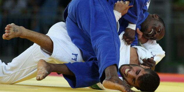 2016 Rio Olympics - Judo - Preliminary - Men -66 kg Elimination Rounds - Carioca Arena 2 - Rio de Janeiro, Brazil - 07/08/2016. Golan Pollack (ISR) of Israel and Mathews Punza (ZAM) of Zambia compete. REUTERS/Toru Hanai FOR EDITORIAL USE ONLY. NOT FOR SALE FOR MARKETING OR ADVERTISING CAMPAIGNS.