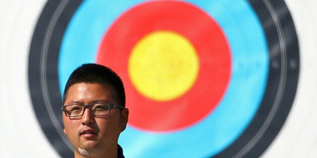 2016 Rio Olympics - Archery - Men's Individual Ranking Round - Sambodromo - Rio de Janeiro, Brazil - 05/08/2016. Kim Woo-Jin (KOR) of South Korea poses. REUTERS/Yves Herman FOR EDITORIAL USE ONLY. NOT FOR SALE FOR MARKETING OR ADVERTISING CAMPAIGNS.