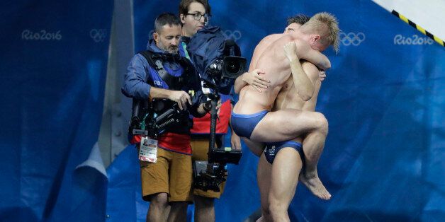 Britain's Jack Laugher and Chris Mears celebrate after winning the men's synchronized 3-meter springboard diving final in the Maria Lenk Aquatic Center at the 2016 Summer Olympics in Rio de Janeiro, Brazil, Wednesday, Aug. 10, 2016. (AP Photo/Wong Maye-E)