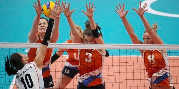 2016 Rio Olympics - Volleyball - Women's Quarterfinals - South Korea v Netherlands - Maracanazinho - Rio de Janeiro, Brazil -16/08/2016. Kim Yeon-Koung (KOR) of South Korea (10) competes against Judith Pietersen (NED) of Netherlands (8), Yvon Belien (NED) of Netherlands (3) and Anne Buijs (NED) of Netherlands. REUTERS/Pilar Olivares FOR EDITORIAL USE ONLY. NOT FOR SALE FOR MARKETING OR ADVERTISING CAMPAIGNS.