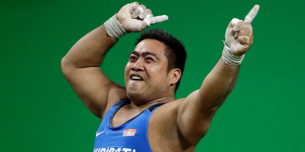 David Katoatau, of Kiribati, dances after a successful lift in the men's 105 kg weightlifting event at the 2016 Summer Olympics in Rio de Janeiro, Brazil, Monday, Aug. 15, 2016. (AP Photo/Mike Groll)
